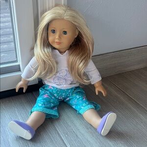 American Girl Doll with Blonde Hair and Teal Outfit